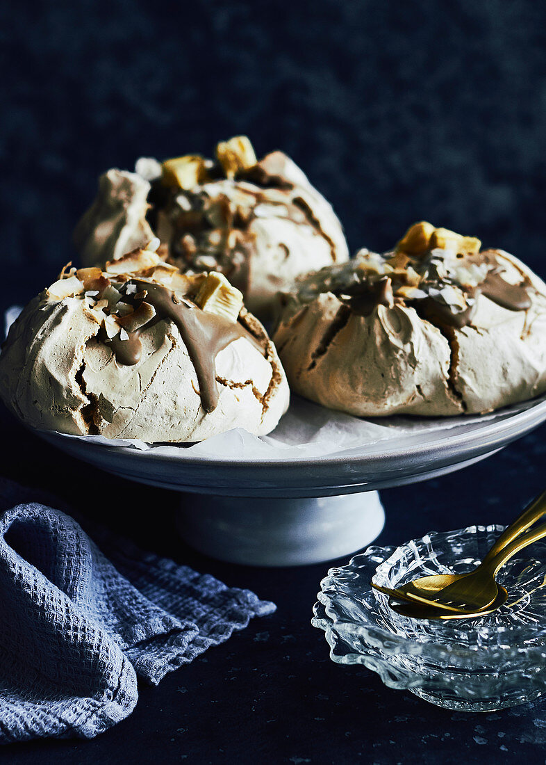 Caramel and toasted coconut meringues with dehydrated pinapple on top
