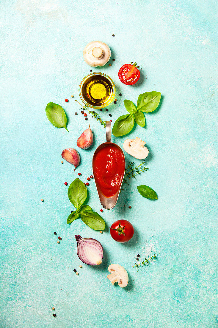 Fresh ingredients for italian or vegetarian food on blue stone background