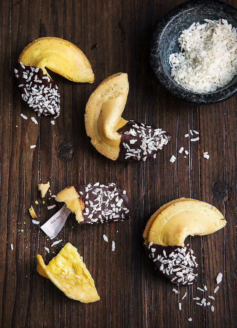 Fortune cookies with chocolate icing and grated coconut (top view)