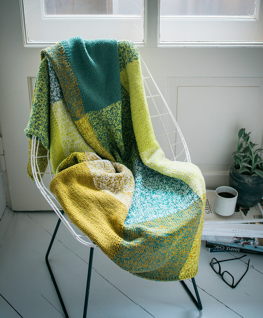 A hand-knitted checked blanket