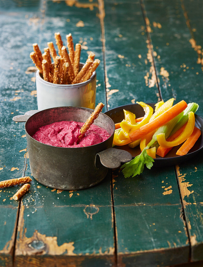 Beetroot dip with vegetable stick and bread sticks