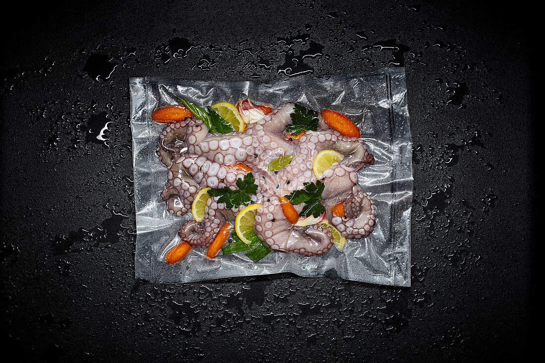 Octopus with lemons and herbs in a sous vide bag