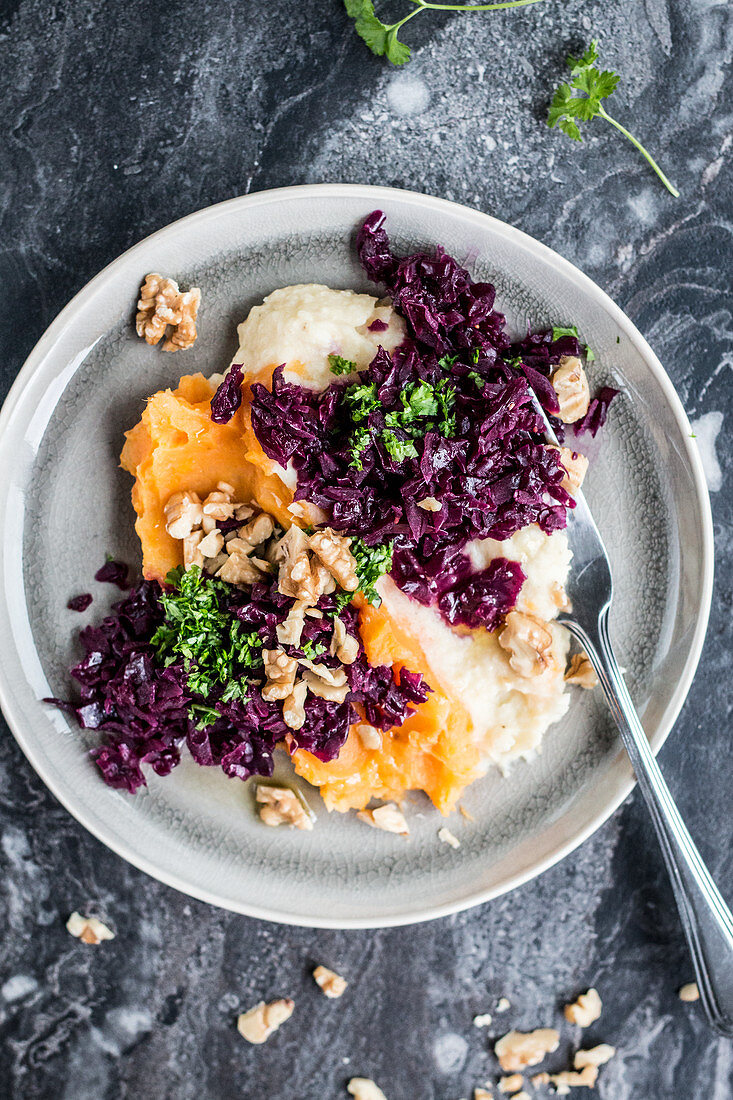 Two types of mashed potatoes with red cabbage and walnuts
