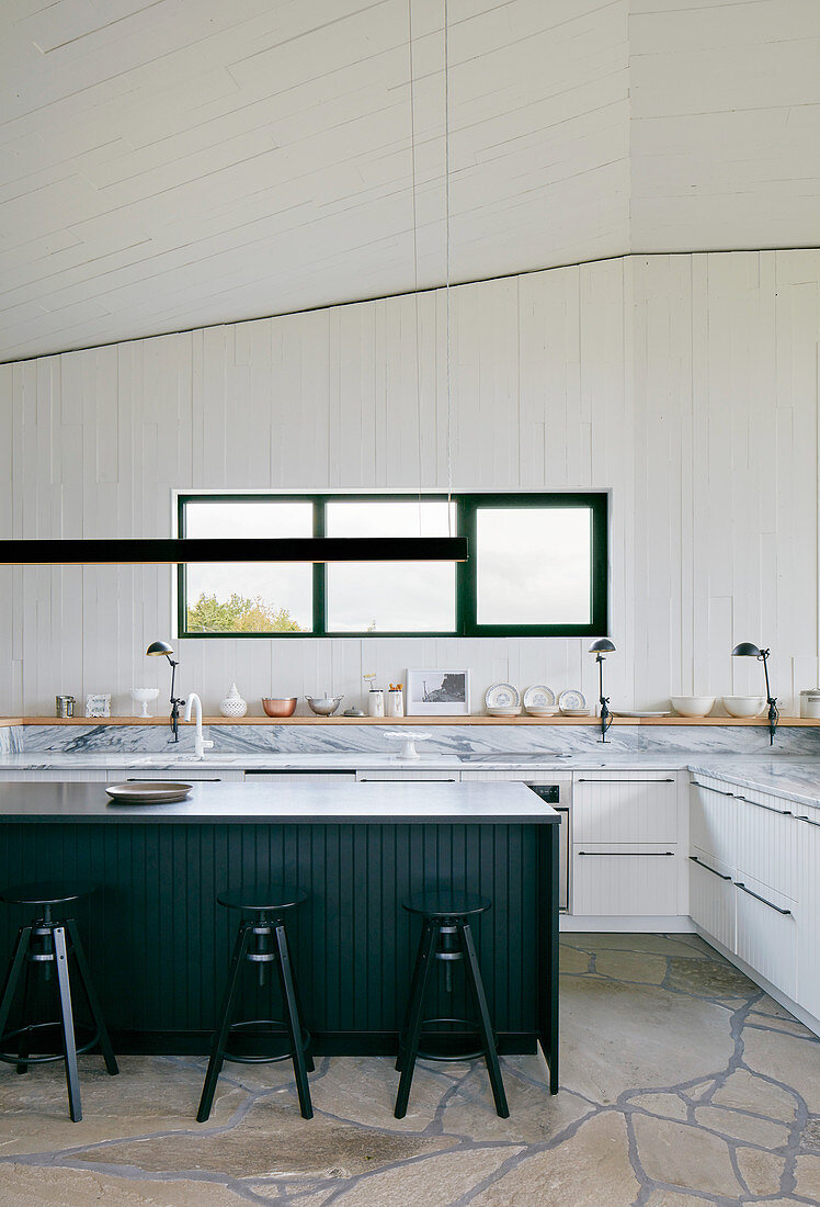 Modern country-house kitchen without wall units in architect-designed house