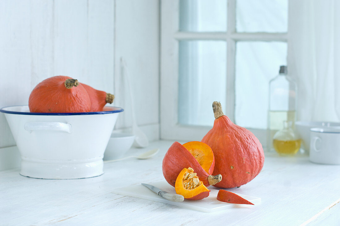 Hokkaido pumpkin on a rustic wooden surface