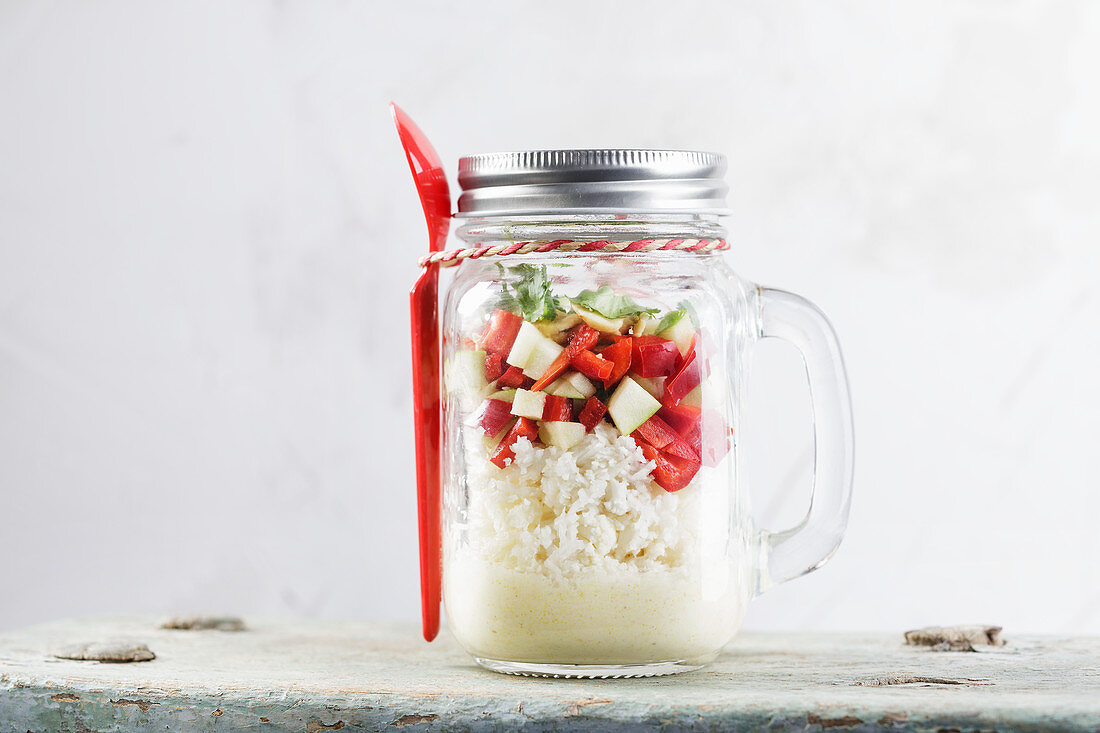 Low-carb cauliflower and rice salad in a jar to take away