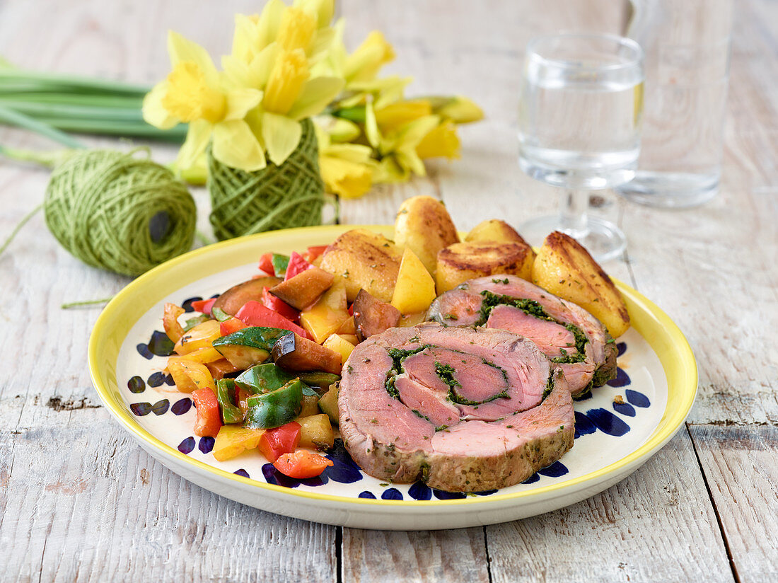 Stuffed leg of lamb with rosemary potatoes and Provençal vegetables