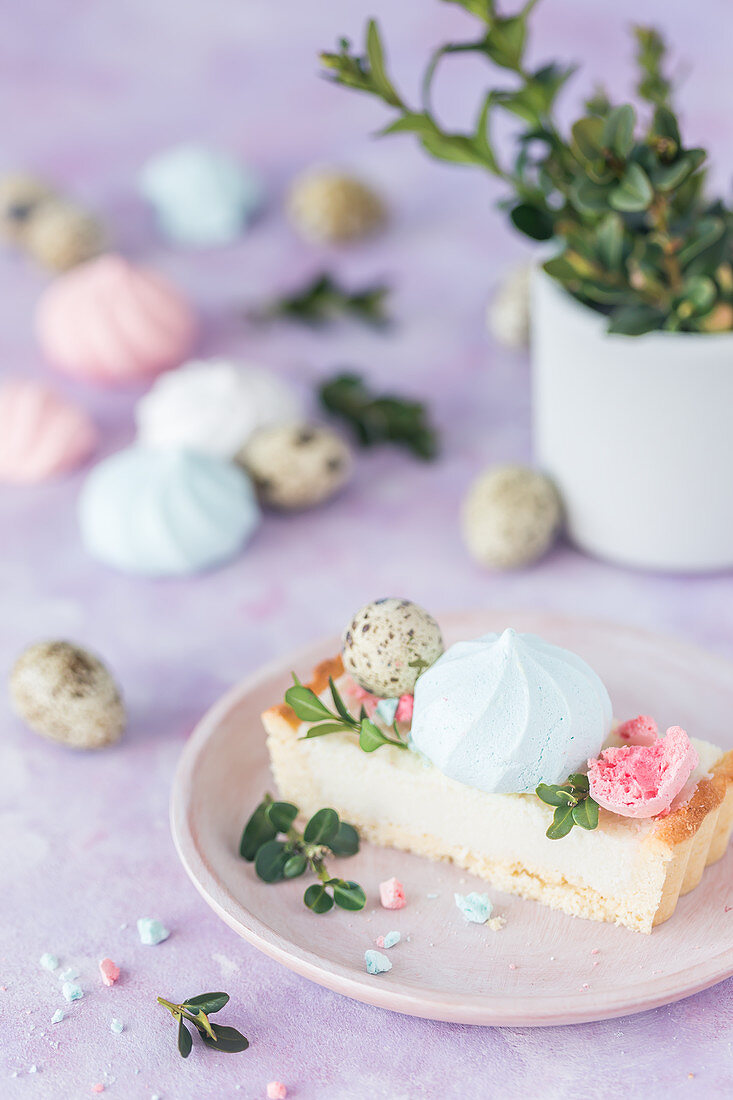 Slice of a Polish Easter cake (mazurek) decorated with colorful meringues