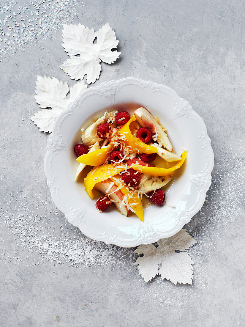 Christmas fruit salad with lime syrup and coconut