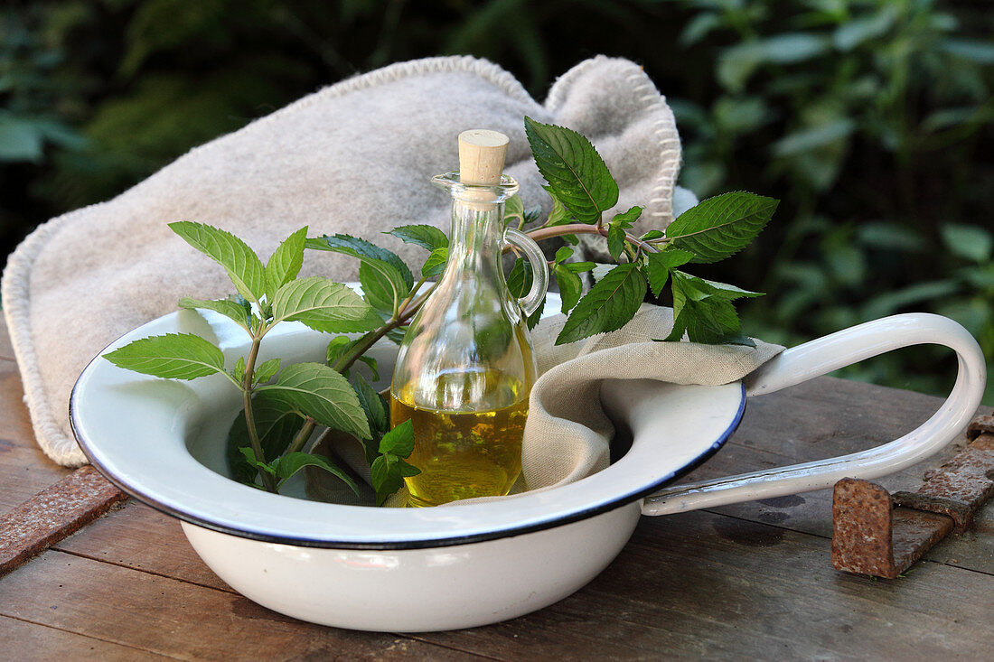 Peanut oil with peppermint and rosemary for a stomach massage to treat digestive problems