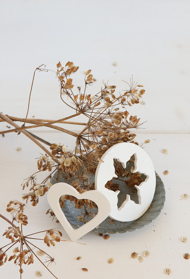 Shapes cut out of modelling clay arranged on flan tin