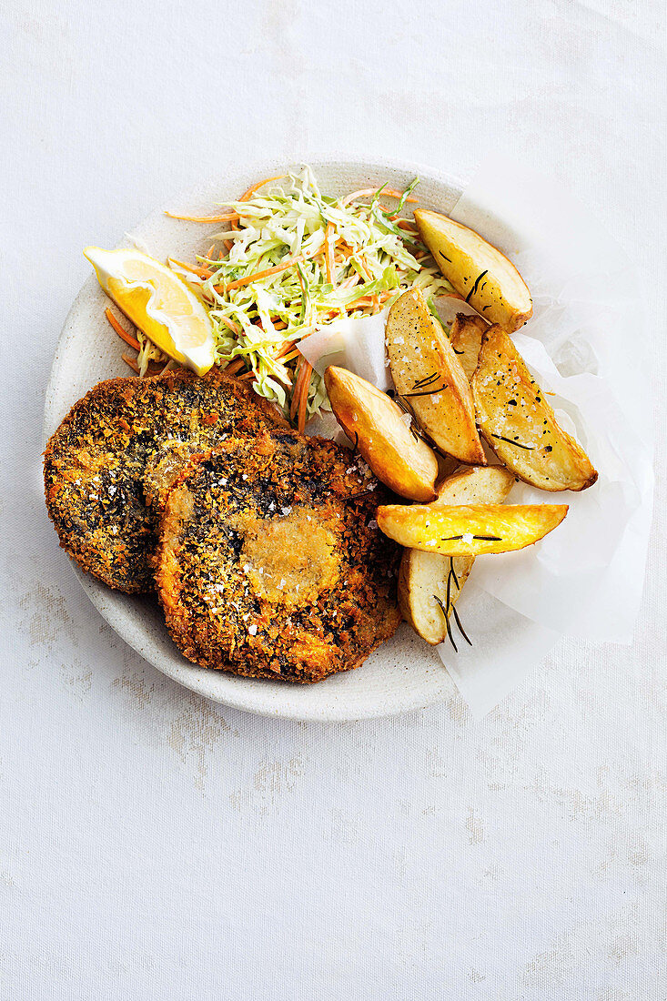 Breaded mushrooms with potato wedges and coleslaw