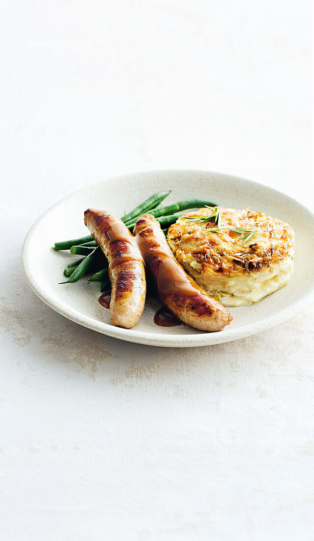 Pork sausages with cabbage and gruyère gratin