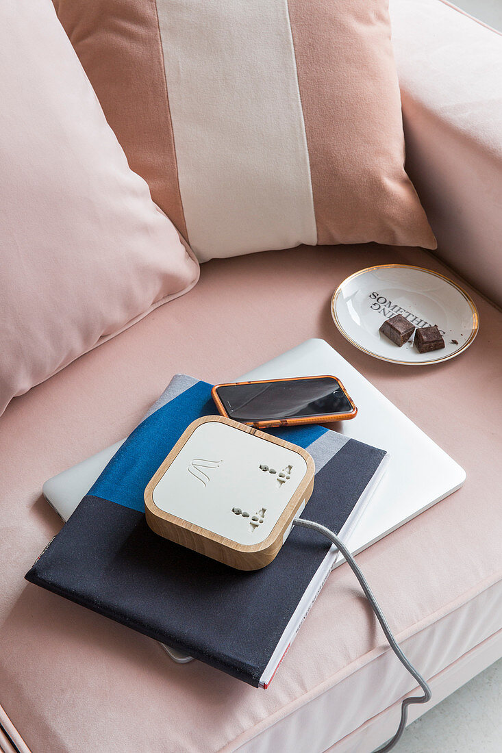 Mobile workspace on pink armchair