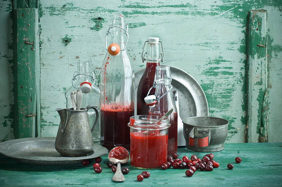 Cornelian cherry juice in bottles and Cornelian cherry jam in a jar