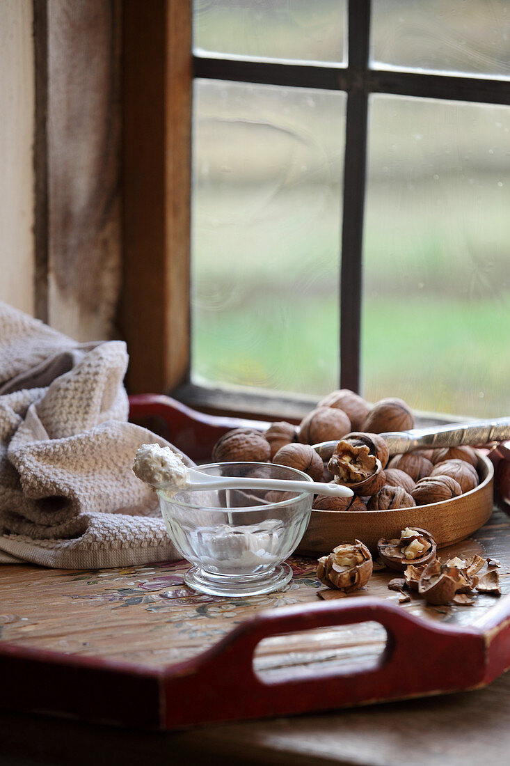 Ingredients for a facial peeling with yoghurt and walnut