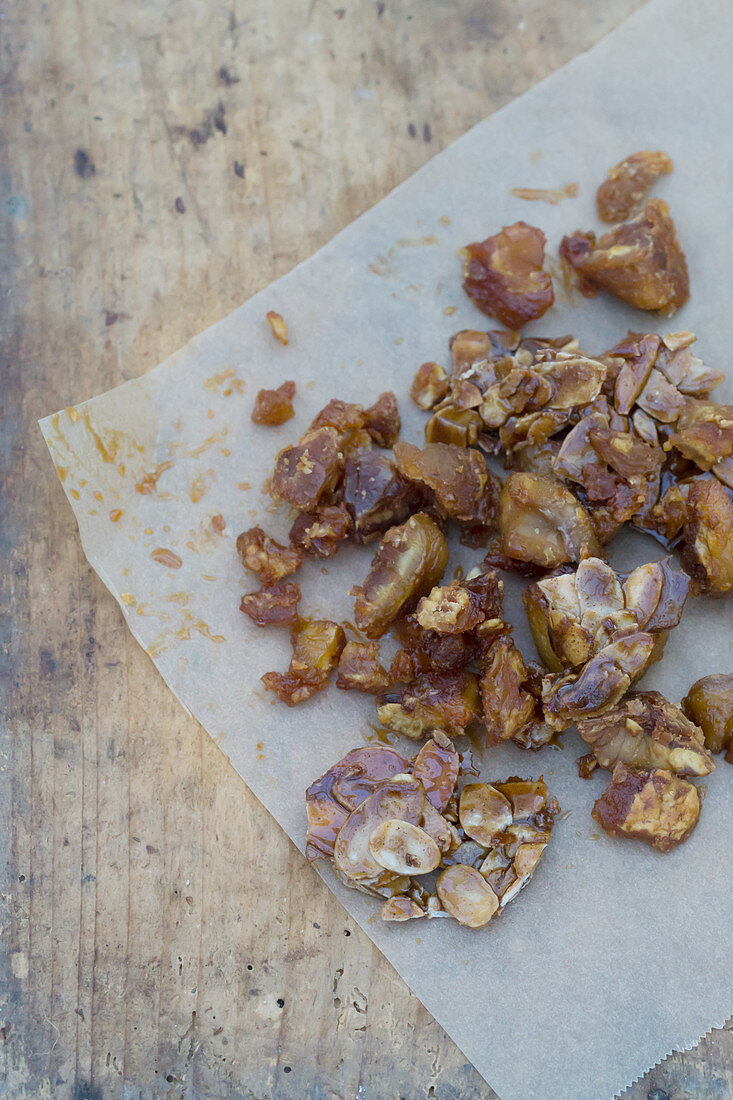 Caramelized almond flakes on paper