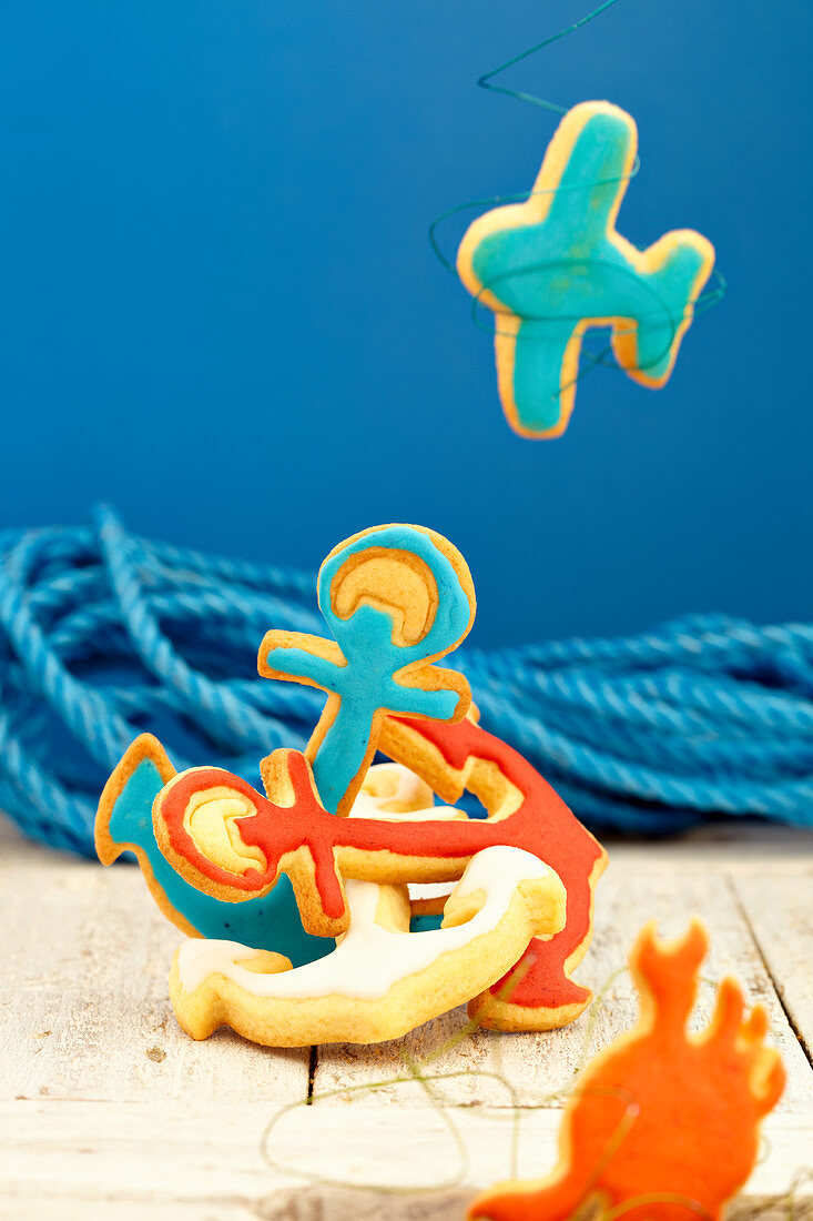 Colorful maritime biscuits in the form of anchors, airplanes and crabs