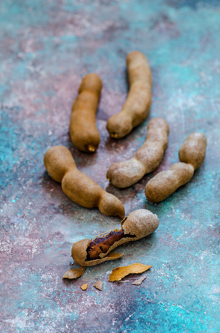 Exotic fruit tamarind on a colored background