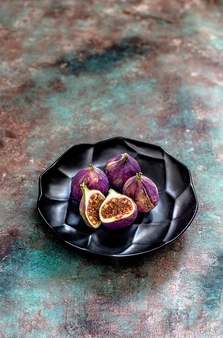 Figs on a black plate