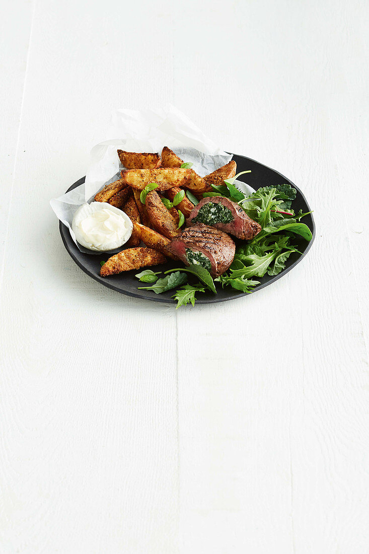 Spinach and feta steak with salty-sweet wedges