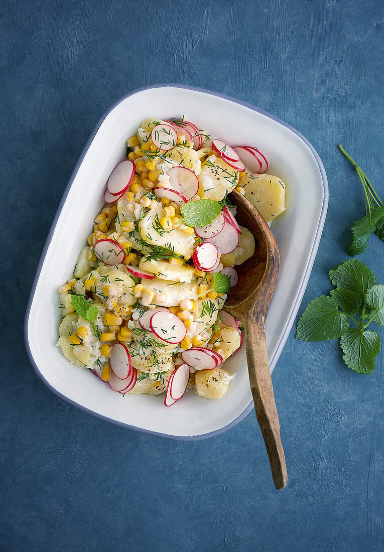 Potato salad with corn and radishes