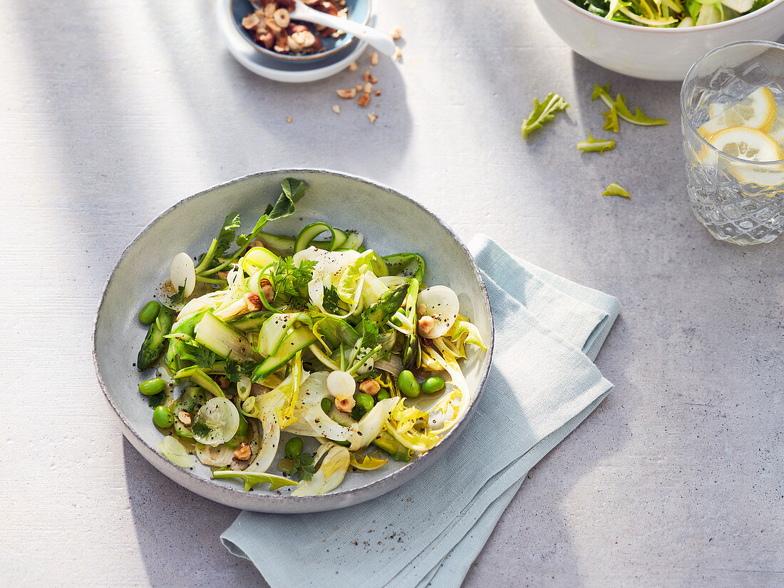 Spring salad with green asparagus, dandelions, fennel, broad beans and courgette
