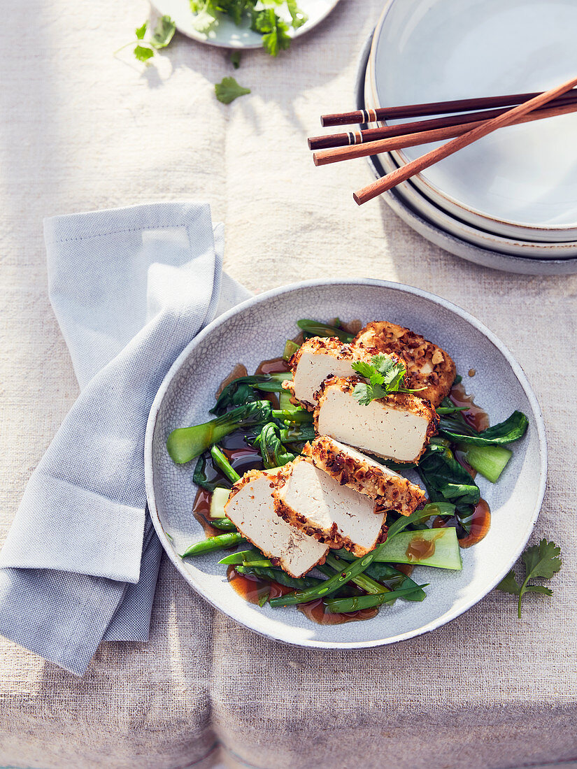 Tofu with a nut crust with bok choy, green beans and soy sauce