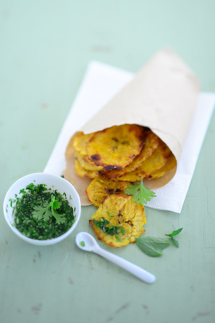 Plantain chips with green mojo sauce