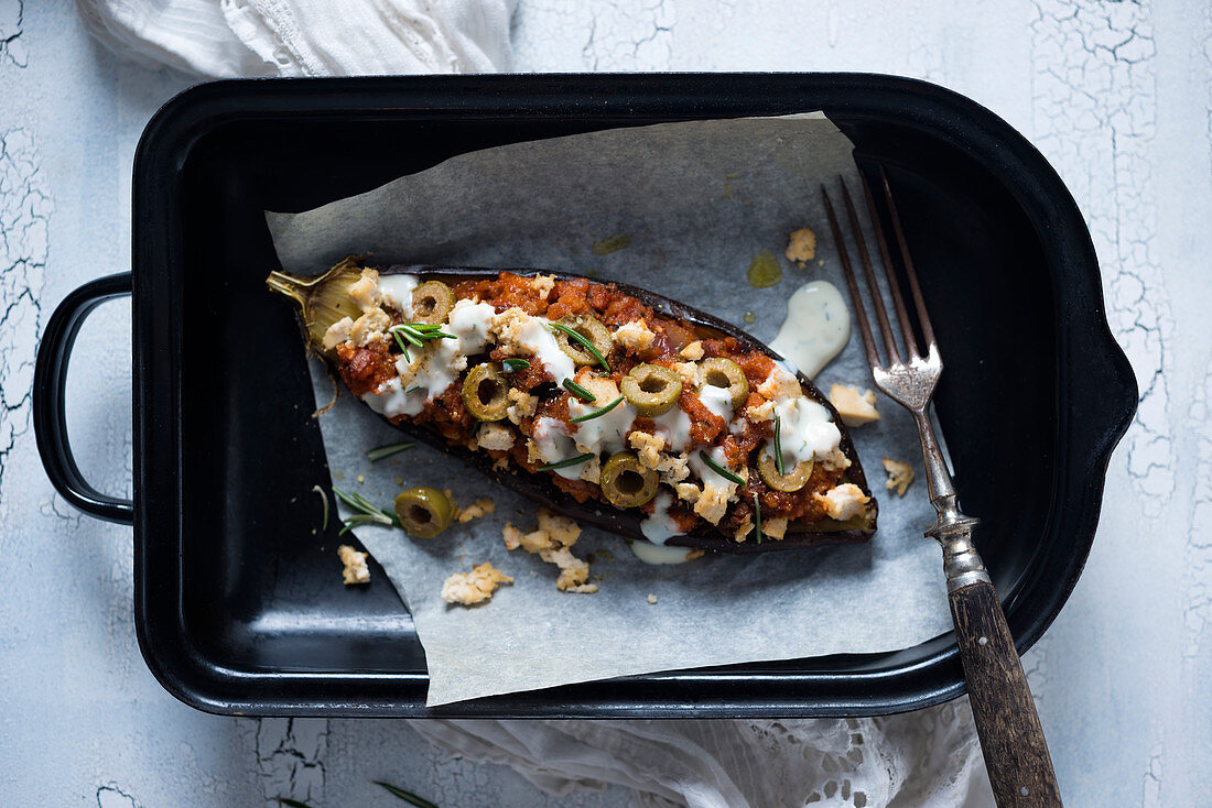 Aubergines filled with beans, olives and tofu (vegan)