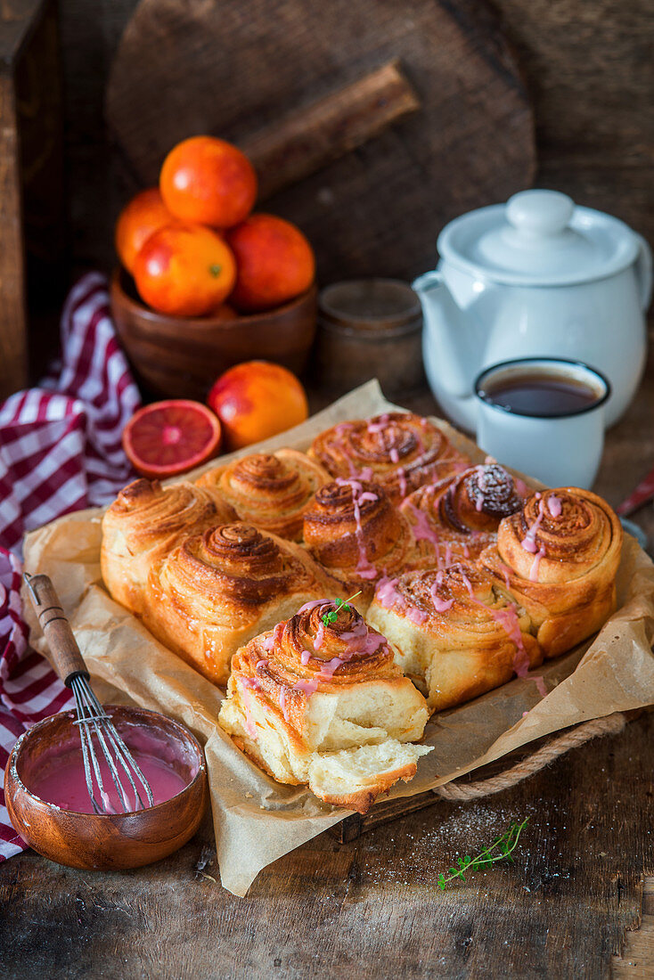 Yeast snails with blood orange zest and orange icing