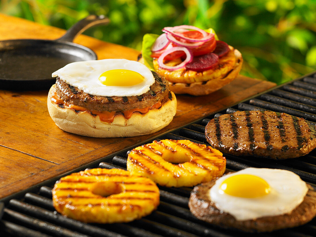 Burger with fried egg and pineapple