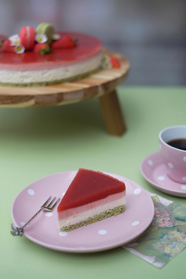 A slice of lemon and strawberry mousse cake