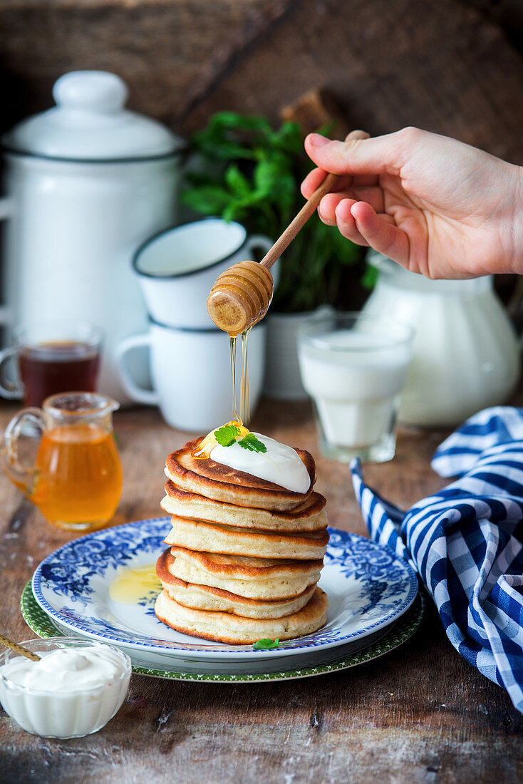 Pancakes with sour cream and honey