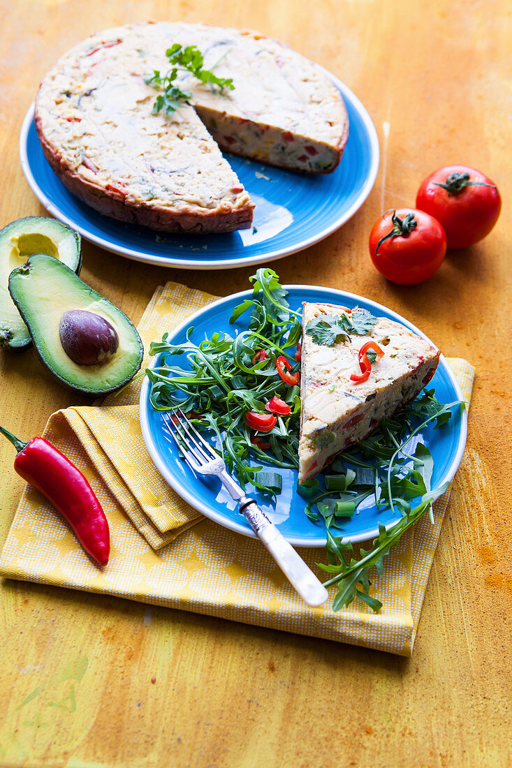 Mexican vegan farinata with avocado and tomato