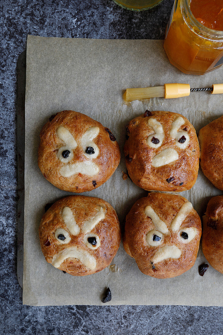 Hand made hot cross buns with a twist, with a decorative angry face