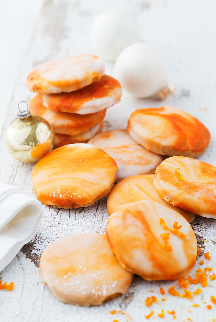 Orange biscuits with marbled orange icing