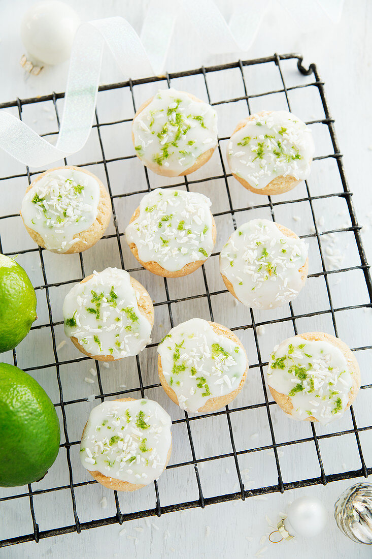 Lime and coconut shortbread biscuits on a cooling rack