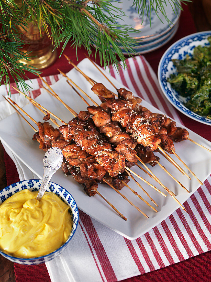 Chicken skewers, saffron yogurt and kale