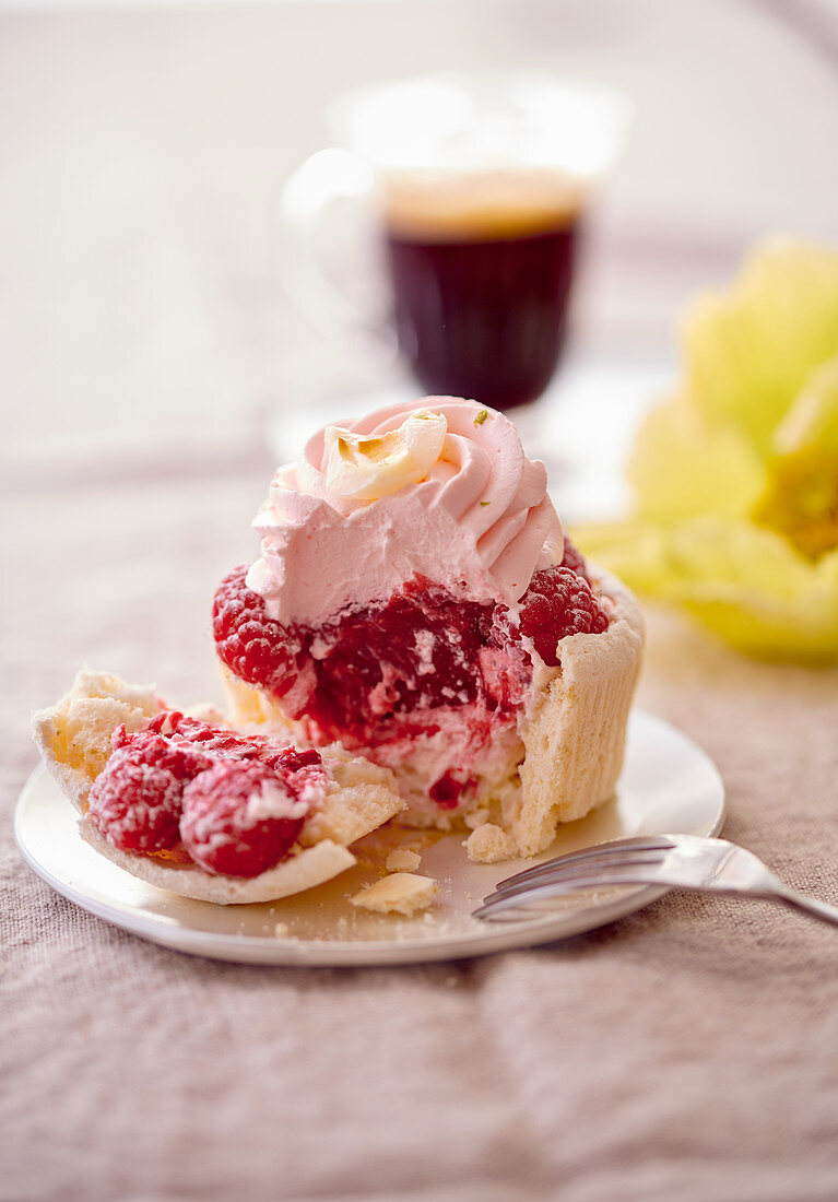 Raspberry tart with meringue, sliced