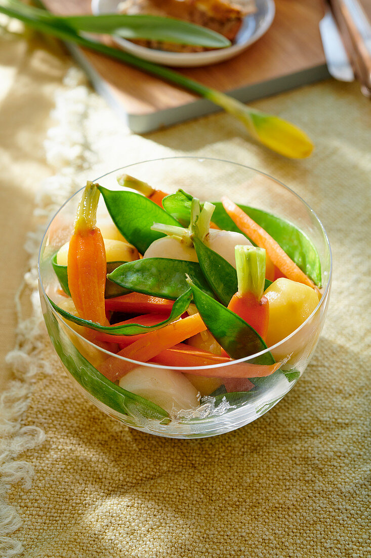 Spring vegetables in a glass cup