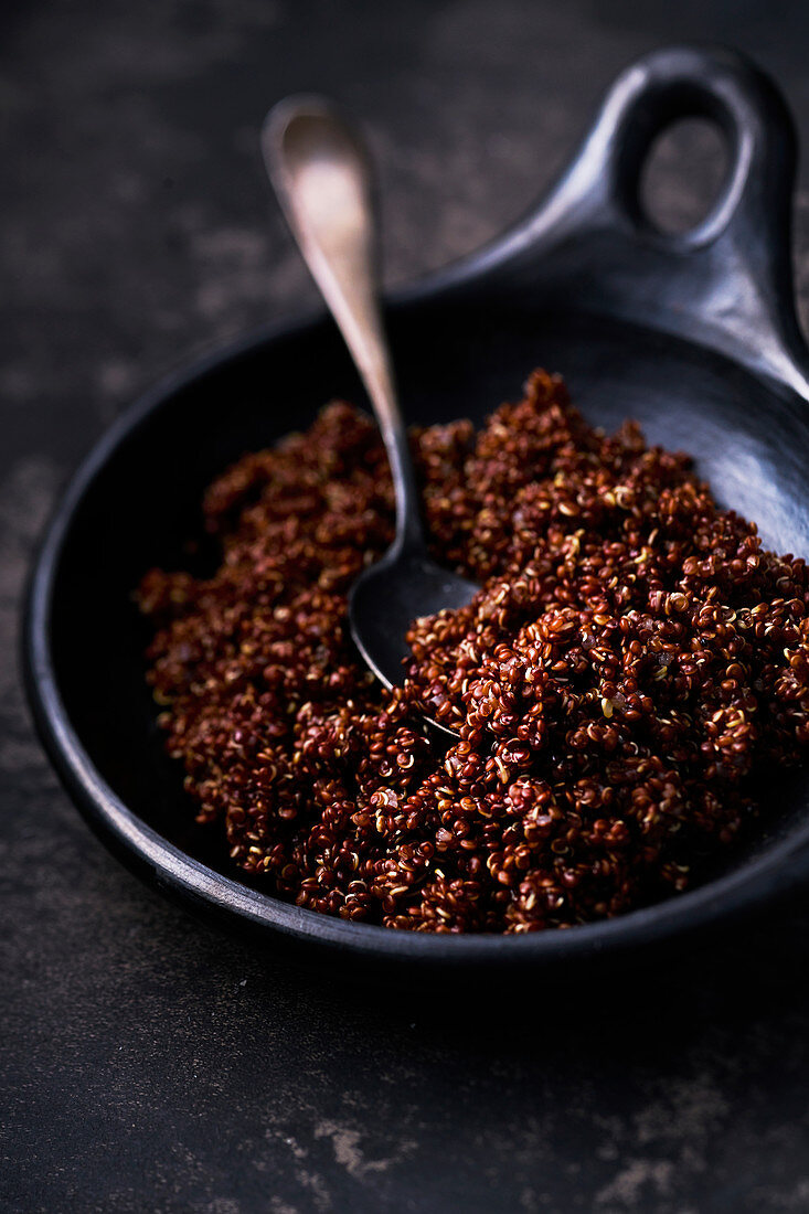 Red cooked Quinoa with spoon