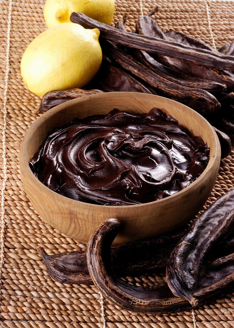 Carob cream in a wooden bowl