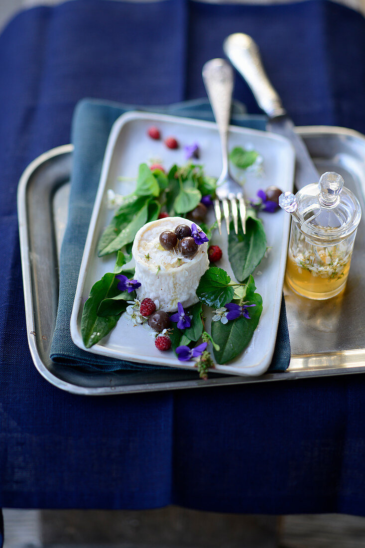 Goat's cheese with olives and wild herbs