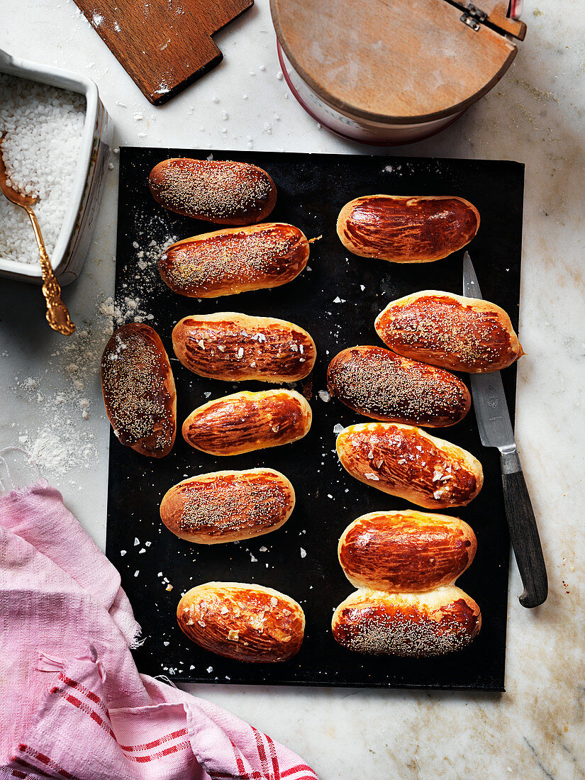 Homemade hot dog rolls with salt and poppy seeds