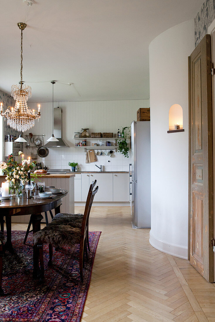 Classic dining area next to open-plan kitchen