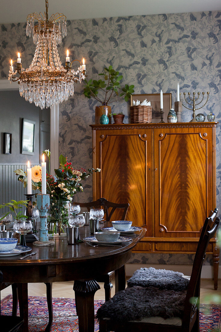 Set table and antique cabinet in dining room