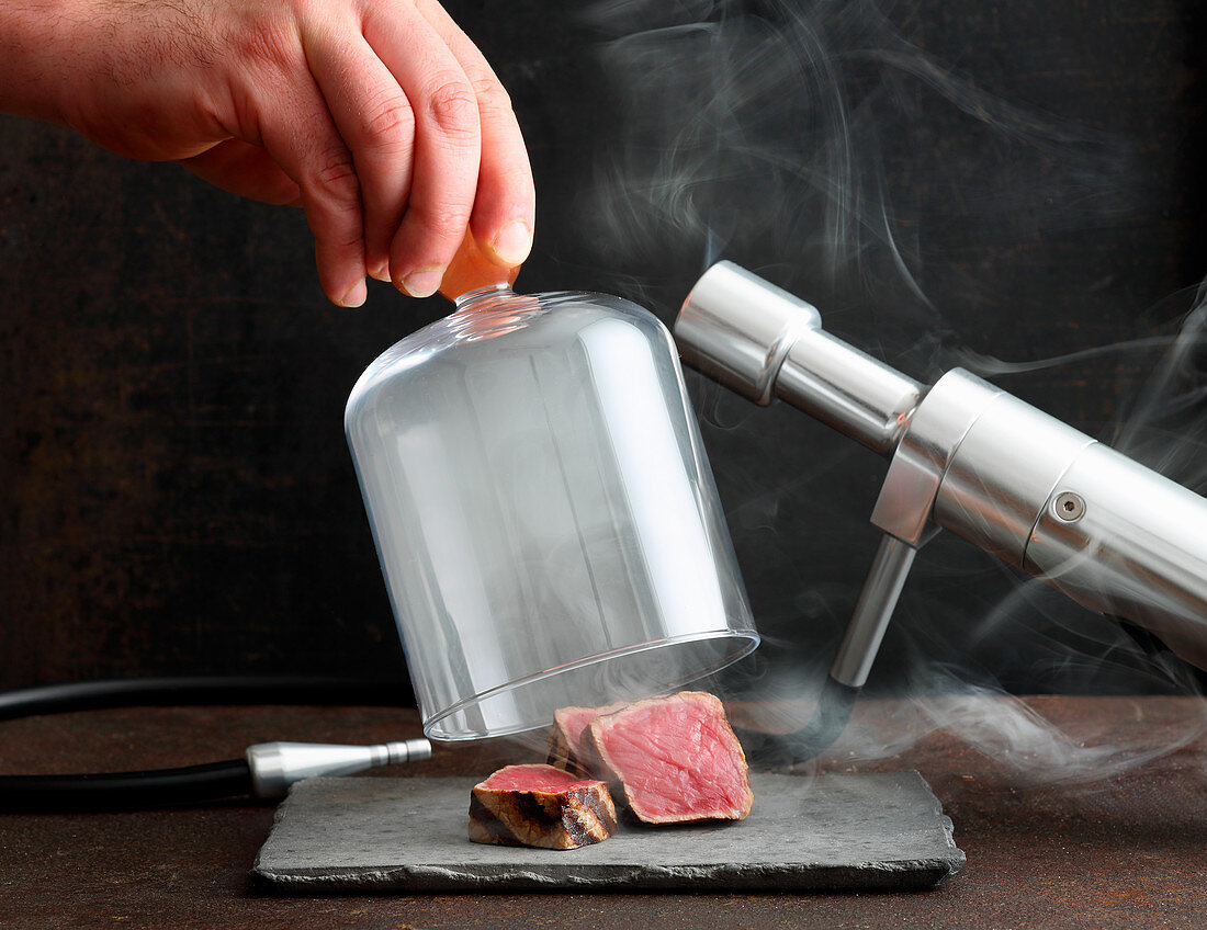 Smoke with a smoking pipe under a glass bell