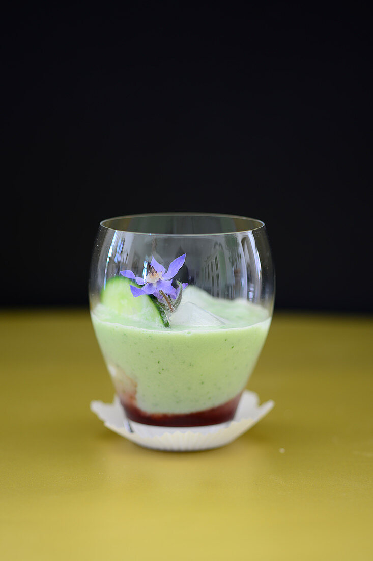 A cold cucumber and yogurt smoothie with borage blossoms