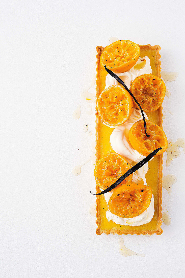 White chocolate and cardamom tart with syrupy mandarins